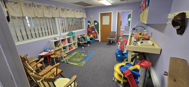The chapel nursery, a bright room full of toys, a play mat and rocking chairs for parents